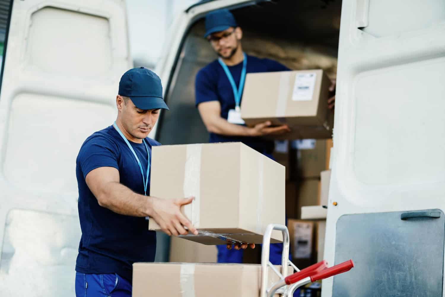 Movers packing boxes for a move in Calgary, showcasing professional packing services.